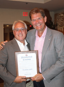 Alan Plafker, CPIA, receives a Presidential Citation from outgoing PIANY President Anthony A. Kubera, CIC