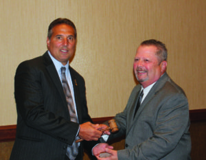 L-R: Immediate Past President Charles J. Caruso, CIC, CPIA, passes the ceremonial gavel to newly elected president Donald F. Lapenna, Jr., during the PIANJ annual business meeting Sunday morning