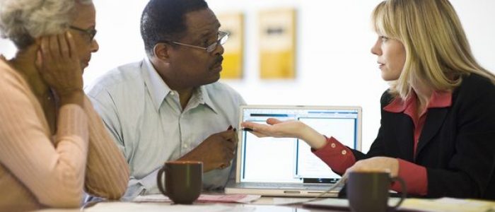 adviser meeting with mature black couple istock 52