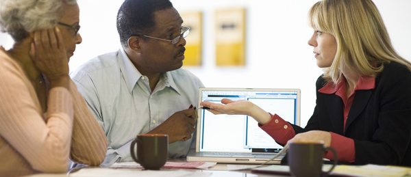 adviser meeting with mature black couple istock 52