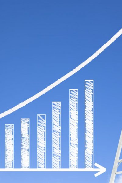 business man writing growth bar chart with sky background