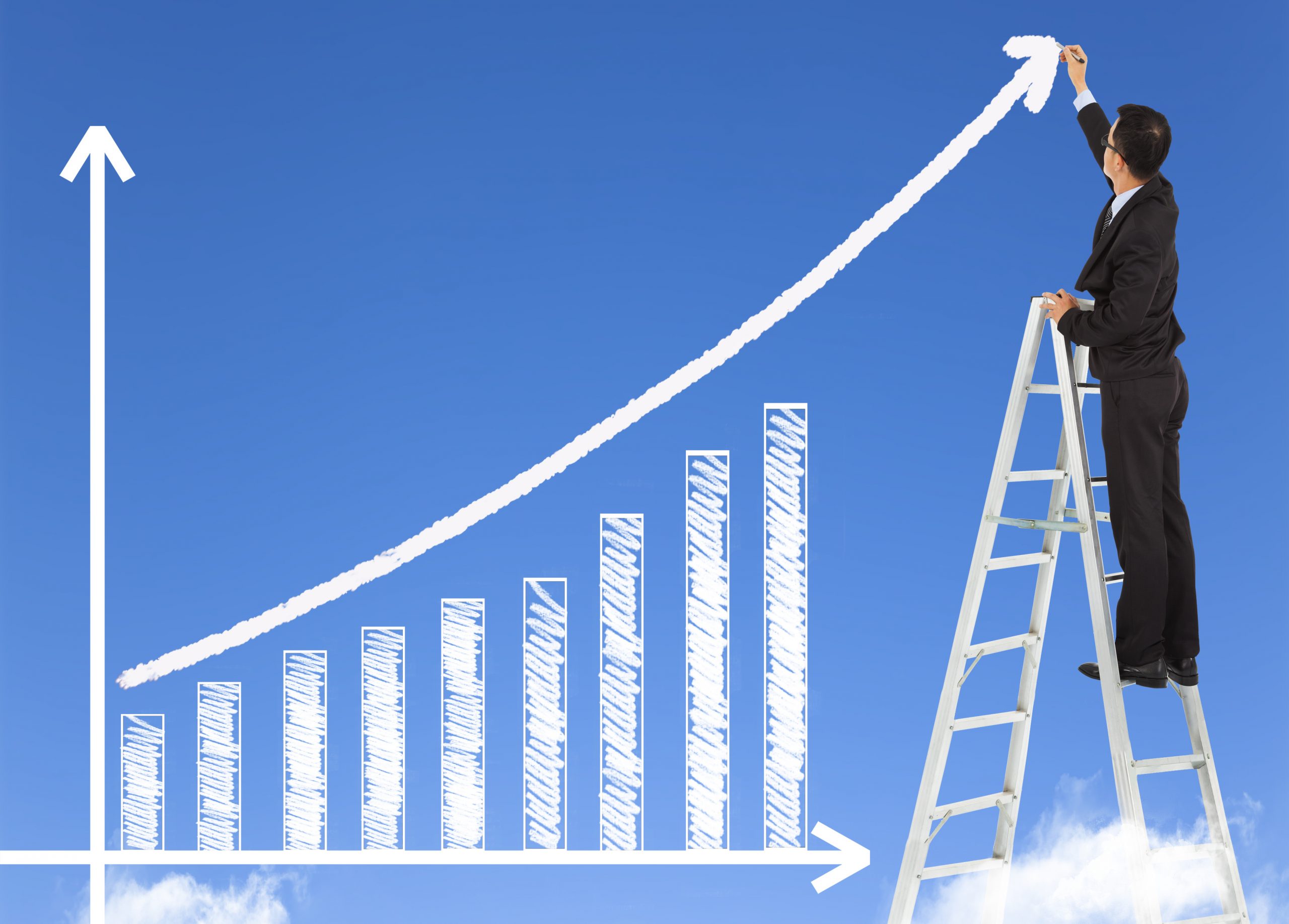 business man writing growth bar chart with sky background